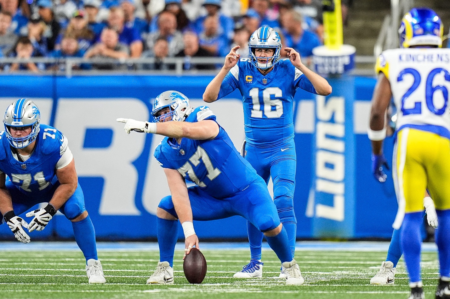 Detroit Lions quarterback Jared Goff (16) talks to center Frank Ragnow (77) before a snap against Los Angeles Rams during the second half at Ford Field in Detroit on Sunday, September 8, 2024. © Junfu Han / USA TODAY NETWORK