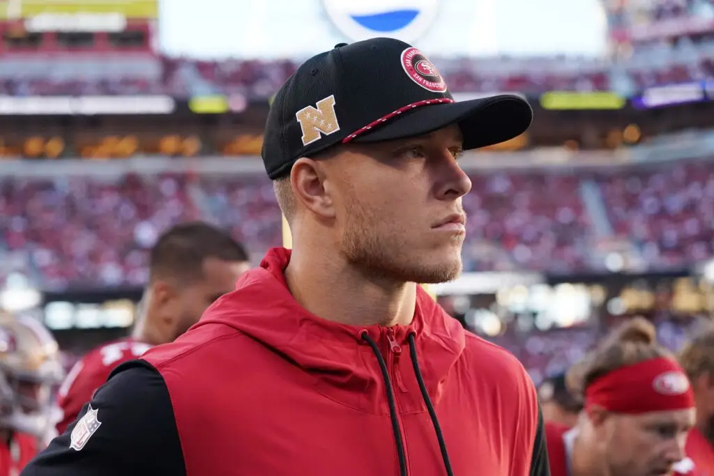 Sep 9, 2024; Santa Clara, California, USA; San Francisco 49ers running back Christian McCaffrey (23) watches from the sideline due to injury during the second quarter against the New York Jets at Levi's Stadium. Mandatory Credit: David Gonzales-Imagn Images