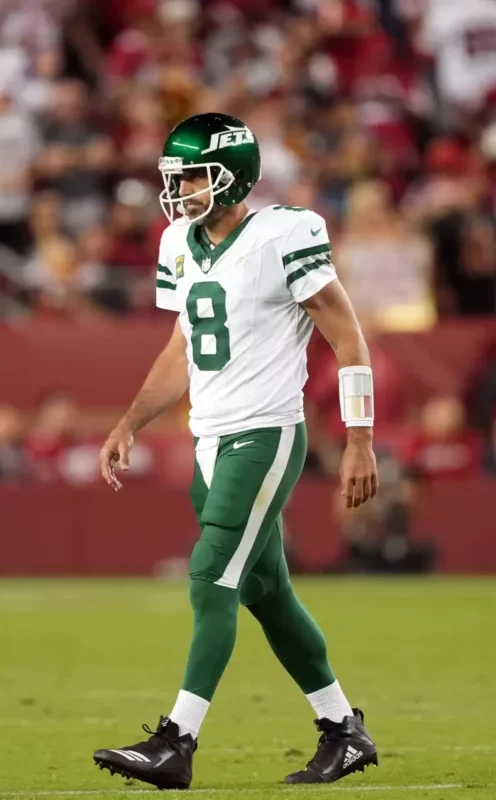 Sep 9, 2024; Santa Clara, California, USA; New York Jets quarterback Aaron Rodgers (8) walks off of the field during the fourth quarter against the San Francisco 49ers at Levi's Stadium. Mandatory Credit: Darren Yamashita-Imagn Images