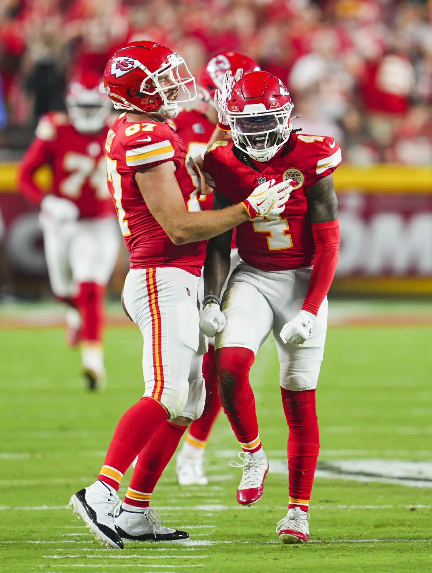 Sep 5, 2024; Kansas City, Missouri, USA; Kansas City Chiefs wide receiver Rashee Rice (4) celebrates with tight end Travis Kelce (87) after a play during the second half against the Baltimore Ravens at GEHA Field at Arrowhead Stadium. Mandatory Credit: Jay Biggerstaff-Imagn Images