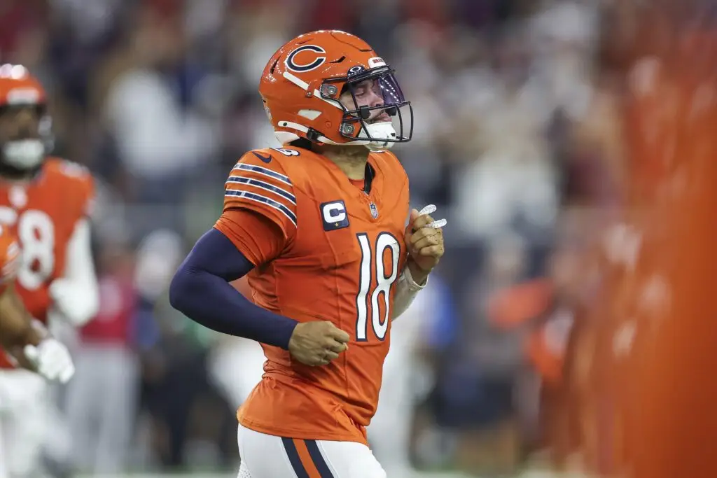 Sep 15, 2024; Houston, Texas, USA; Chicago Bears quarterback Caleb Williams (18) jogs off the field after a play during the third quarter against the Houston Texans at NRG Stadium. Mandatory Credit: Troy Taormina-Imagn Images