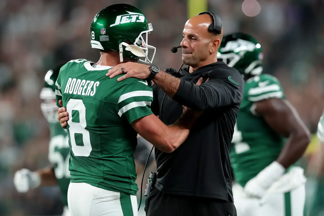 Sep 19, 2024; East Rutherford, New Jersey, USA; New York Jets head coach Robert Saleh hugs quarterback Aaron Rodgers (8) after a touchdown by running back Breece Hall (not pictured) during the second quarter against the New England Patriots at MetLife Stadium. Mandatory Credit: Brad Penner-Imagn Images