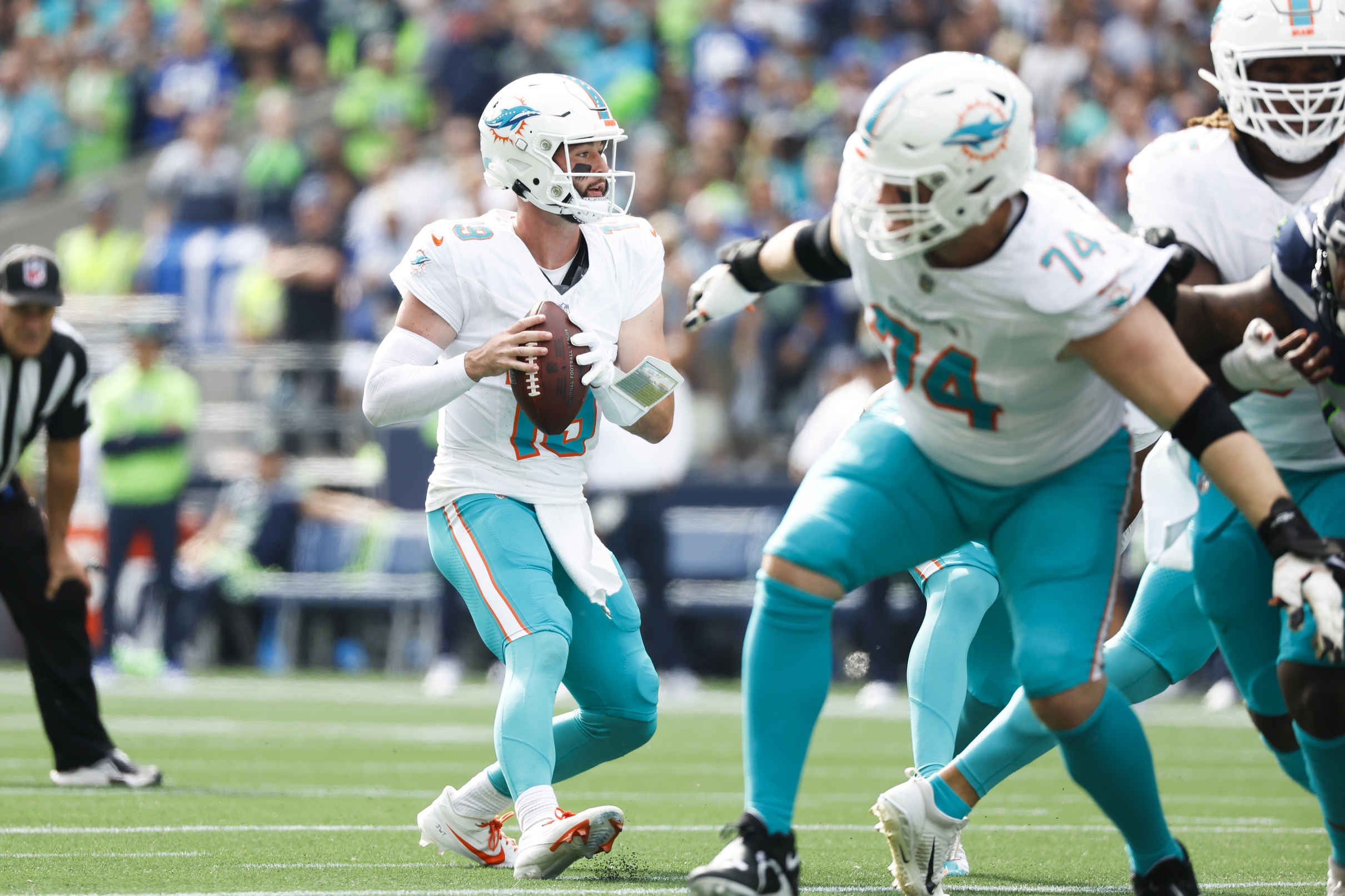 Sep 22, 2024; Seattle, Washington, USA; Miami Dolphins quarterback Skylar Thompson (19) looks to pass against the Seattle Seahawks during the first quarter at Lumen Field. Mandatory Credit: Joe Nicholson-Imagn Images