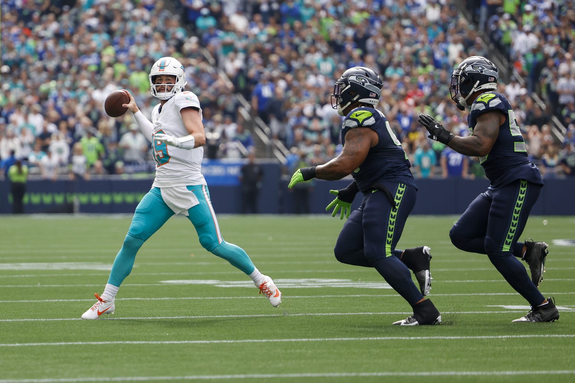 Sep 22, 2024; Seattle, Washington, USA; Miami Dolphins quarterback Skylar Thompson (19) passes against the Seattle Seahawks during the second quarter at Lumen Field. Mandatory Credit: Joe Nicholson-Imagn Images