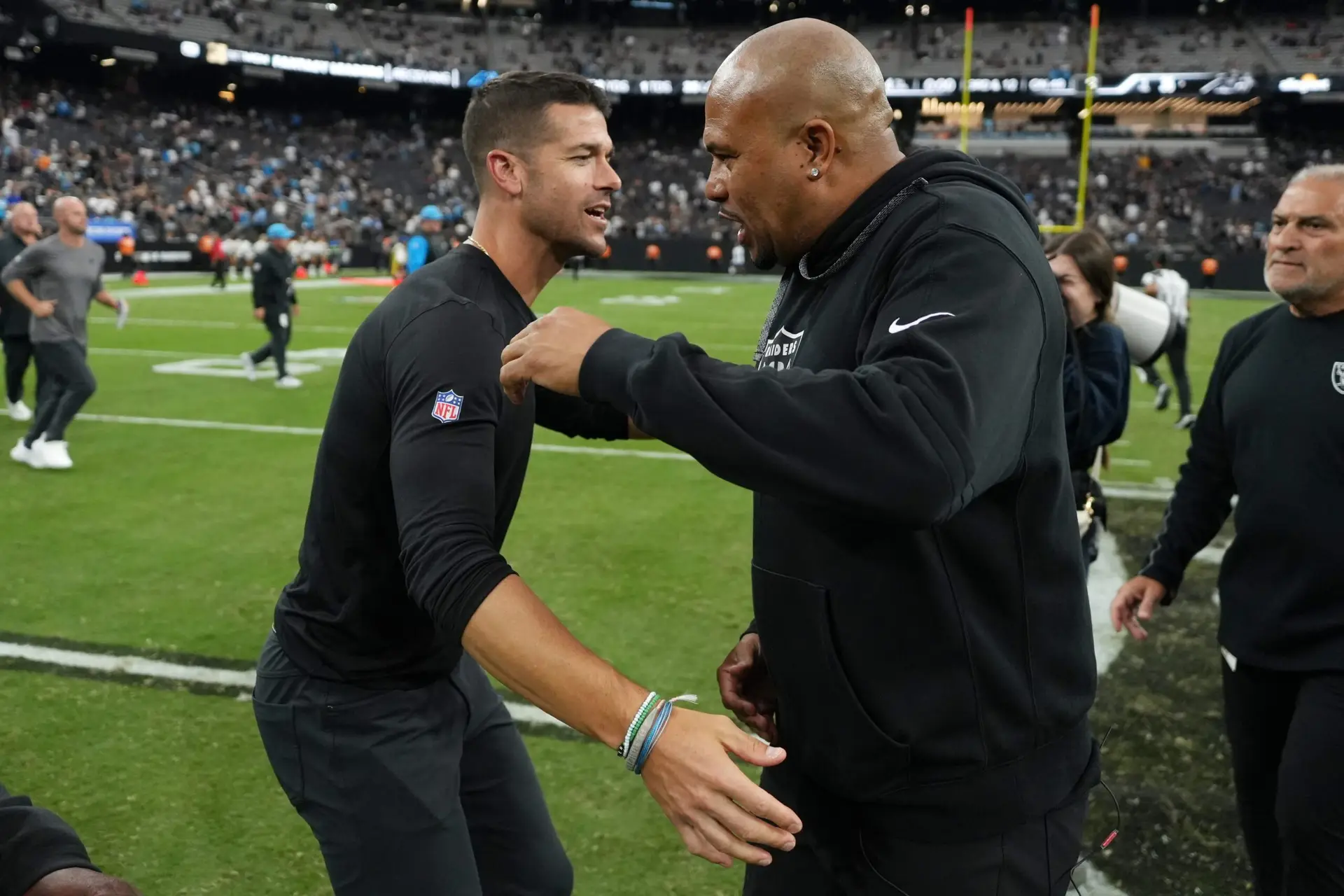 Sep 22, 2024; Paradise, Nevada, USA; Carolina Panthers coach Dave Canales (left) shakes hands with Las Vegas Raiders coach Antonio Pierce after the game at Allegiant Stadium. Mandatory Credit: Kirby Lee-Imagn Images