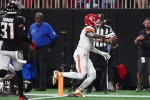 NFL Sep 22, 2024; Atlanta, Georgia, USA; Kansas City Chiefs wide receiver Rashee Rice (4) scores a touchdown against the Atlanta Falcons in the second quarter at Mercedes-Benz Stadium. Mandatory Credit: Brett Davis-Imagn Images