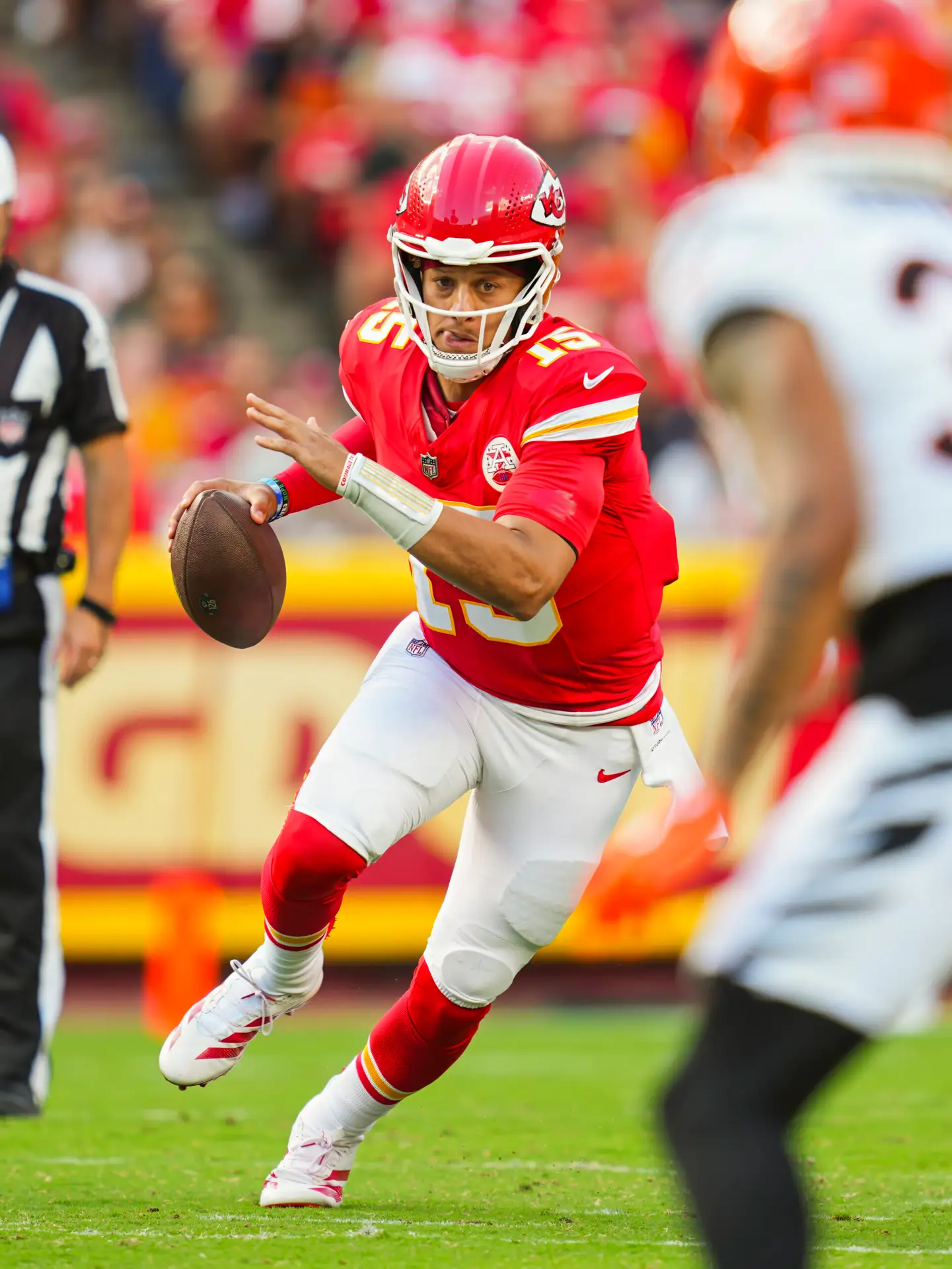 Sep 15, 2024; Kansas City, Missouri, USA; Kansas City Chiefs quarterback Patrick Mahomes (15) scrambles during the first half against the Cincinnati Bengals at GEHA Field at Arrowhead Stadium. Mandatory Credit: Jay Biggerstaff-Imagn Images