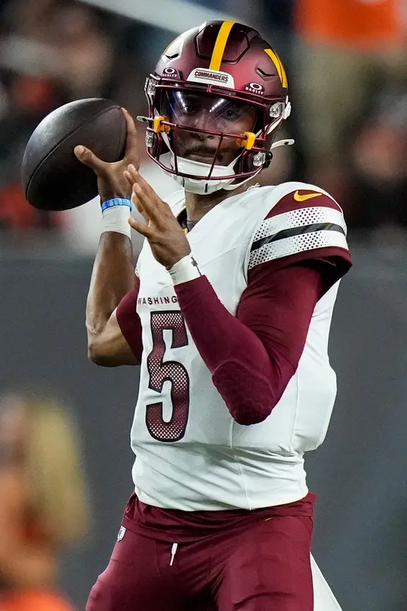 Washington Commanders quarterback Jayden Daniels (5) throws a pass in the second quarter of the NFL Week 3 game between the Cincinnati Bengals and the Washington Commanders at Paycor Stadium in downtown Cincinnati on Monday, Sept. 23, 2024. The Commanders led 21-13 at halftime. © Sam Greene/The Enquirer / USA TODAY NETWORK via Imagn Images