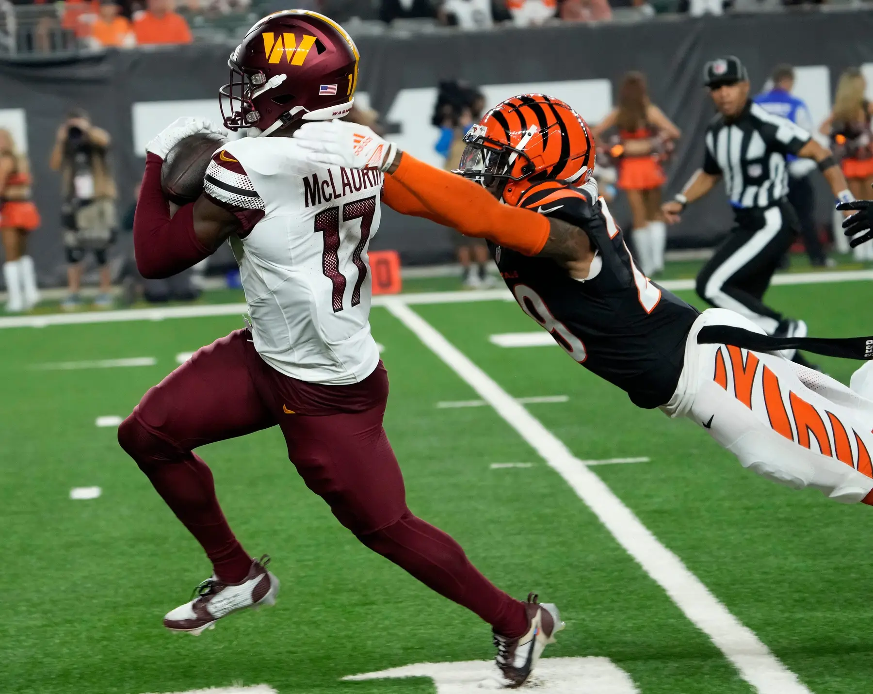 Washington Commanders wide receiver Terry McLaurin (17) runs toward the end zone as Cincinnati Bengals cornerback Cam Taylor-Britt (29) makes the tackle in the 2nd quarter Monday, September 23, 2024 at Paycor Stadium. © Cara Owsley/The Enquirer / USA TODAY NETWORK via Imagn Images