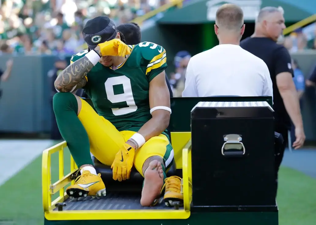 Green Bay Packers wide receiver Christian Watson (9) is carted off the field after getting injured during their football game against the Minnesota Vikings Sunday, September 29, 2024, at Lambeau Field in Green Bay, Wisconsin. © Dan Powers/USA TODAY NETWORK-Wisconsin / USA TODAY NETWORK via Imagn Images