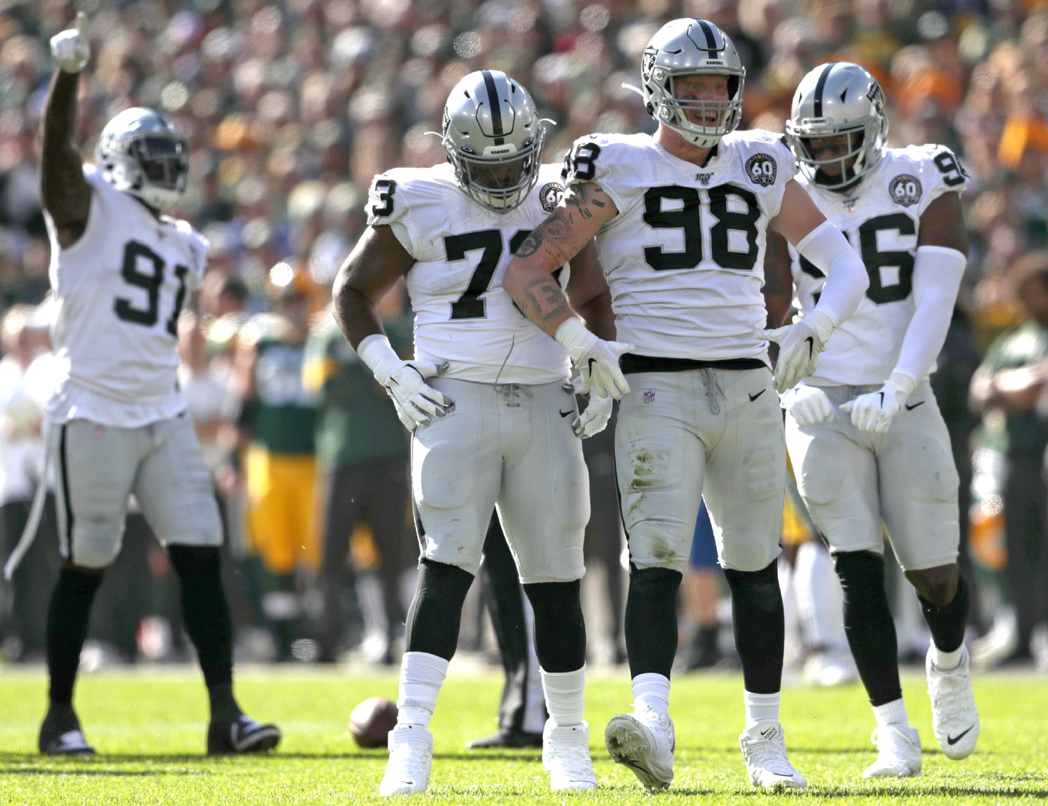 Oakland Raiders defensive end Maxx Crosby (98) celebrates after sacking Green Bay Packers quarterback Aaron Rodgers (12) during their football game on Oct. 20, 2019, at Lambeau Field in Green Bay. © William Glasheen/USA TODAY NETWORK-Wisconsin / USA TODAY NETWORK