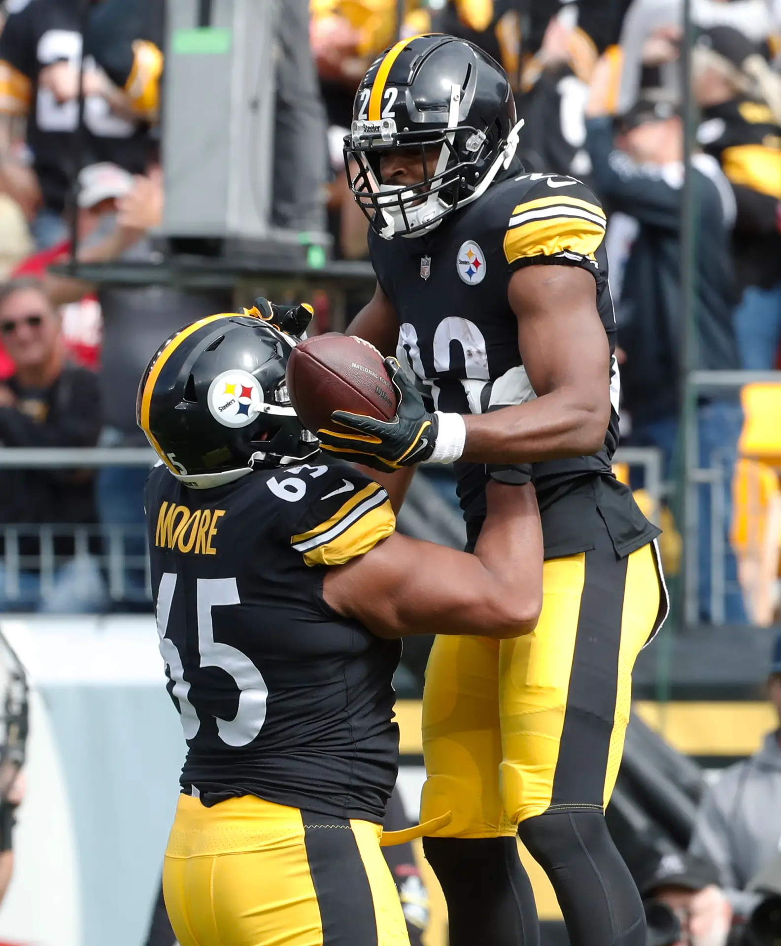 Oct 16, 2022; Pittsburgh, Pennsylvania, USA; Pittsburgh Steelers offensive tackle Dan Moore Jr. (65) celebrates a touchdown by running back Najee Harris (22) against the Tampa Bay Buccaneers during the first quarter at Acrisure Stadium. Mandatory Credit: Charles LeClaire-USA TODAY Sports