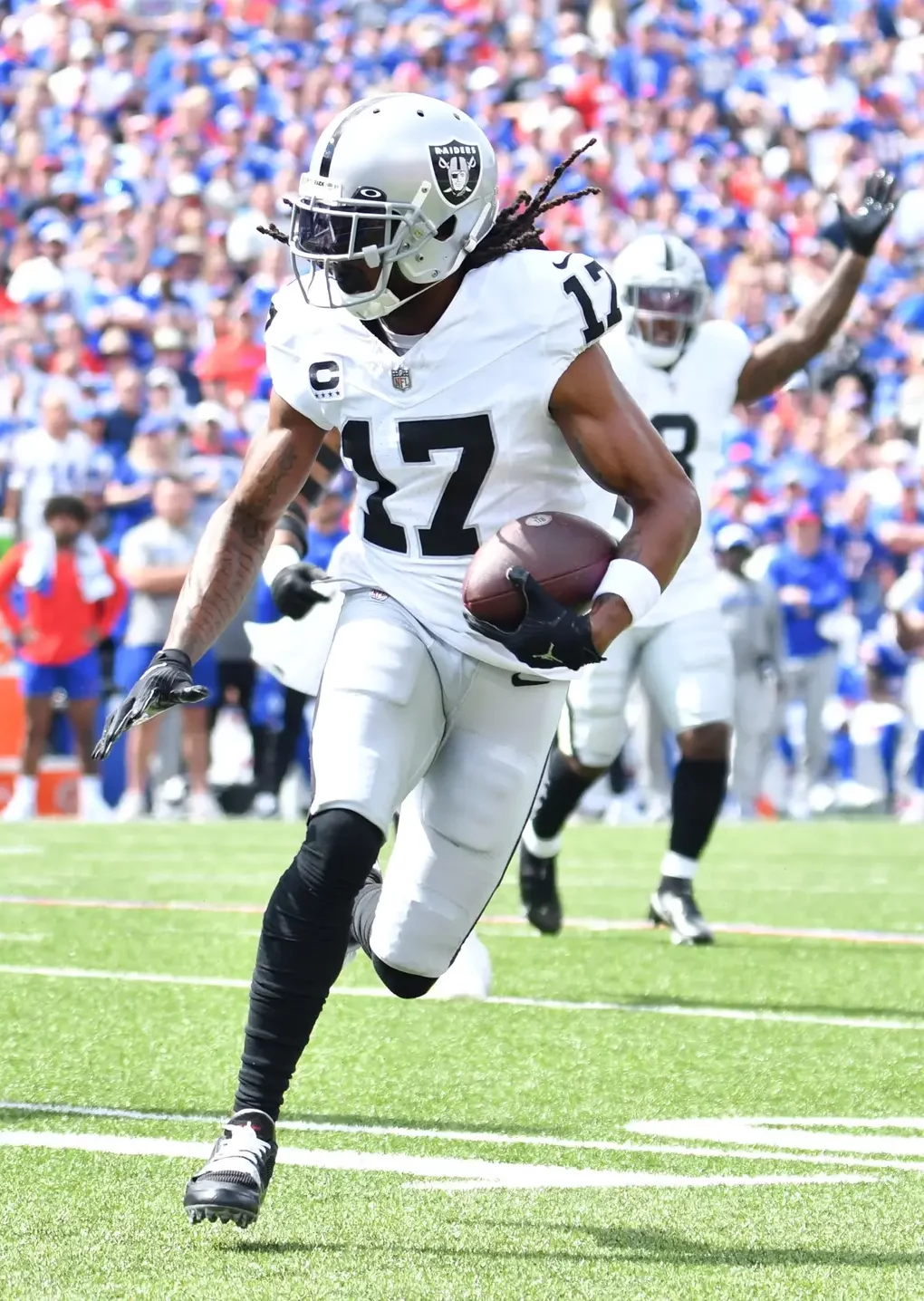 Sep 17, 2023; Orchard Park, New York, USA; Las Vegas Raiders wide receiver Davante Adams (17) runs for the end zone to score a touchdown in the first quarter against the Buffalo Bills at Highmark Stadium. Mandatory Credit: Mark Konezny-Imagn Images