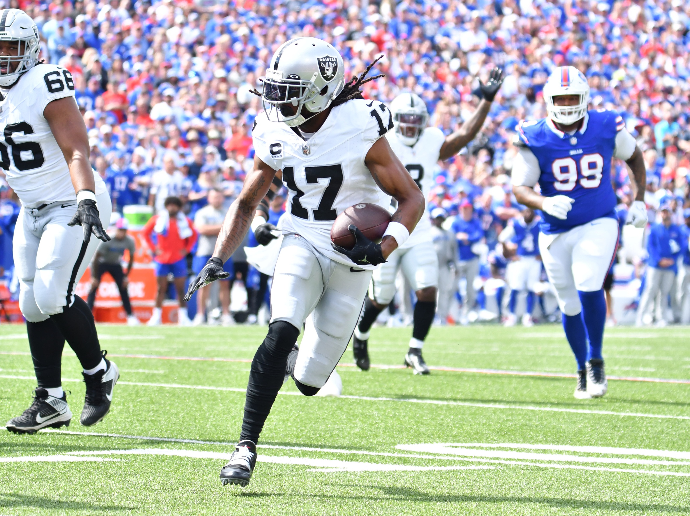 Sep 17, 2023; Orchard Park, New York, USA; Las Vegas Raiders wide receiver Davante Adams (17) runs for the end zone to score a touchdown in the first quarter against the Buffalo Bills at Highmark Stadium. Mandatory Credit: Mark Konezny-Imagn Images