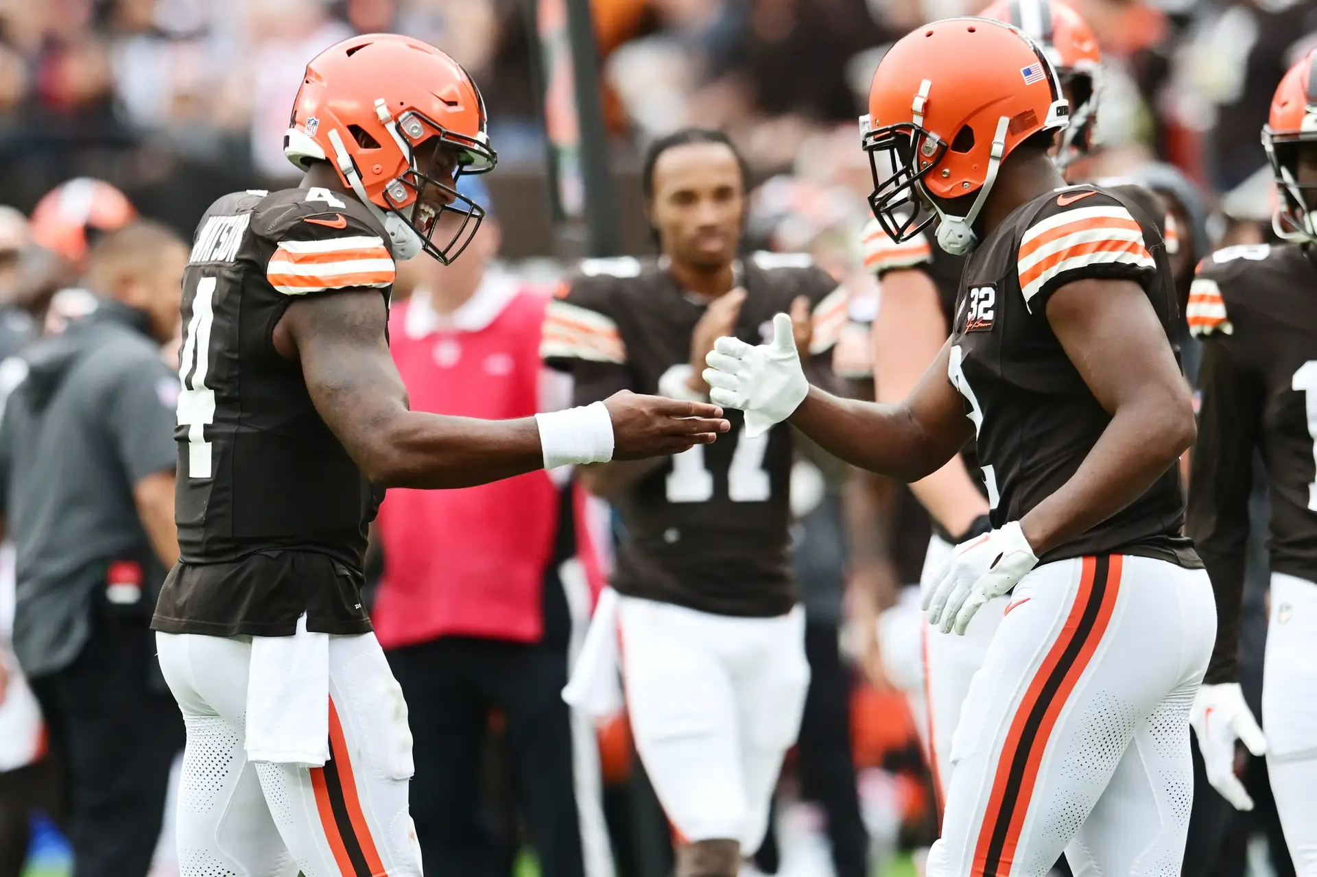 Sep 24, 2023; Cleveland, Ohio, USA; Cleveland Browns quarterback Deshaun Watson (4) celebrates with wide receiver Amari Cooper (2) after they connected on a touchdown pass during the second half against the Tennessee Titans at Cleveland Browns Stadium. Mandatory Credit: Ken Blaze-Imagn Images