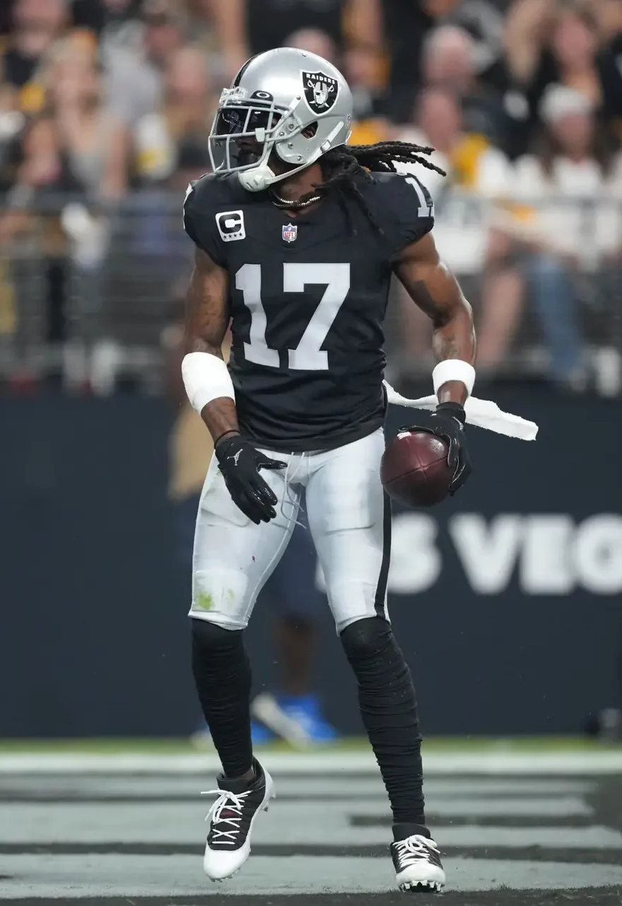 Sep 24, 2023; Paradise, Nevada, USA; Las Vegas Raiders wide receiver Davante Adams (17) reacts after catching a touchdown pass against the Pittsburgh Steelers in the first half at Allegiant Stadium. Mandatory Credit: Kirby Lee-USA TODAY Sports