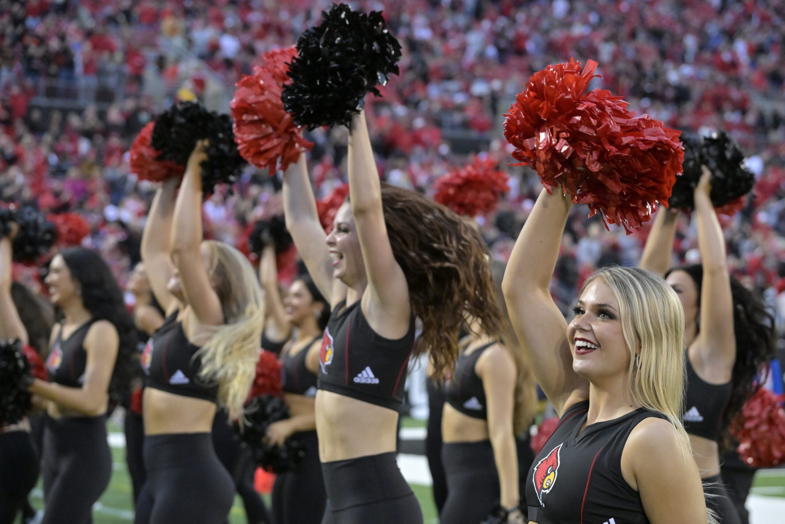 Oct 28, 2023; Louisville, Kentucky, USA; Louisville Cardinals cheerleaders perform during the second half against the Duke Blue Devils at L&N Federal Credit Union Stadium. Louisville defeated Duke 23-0. Mandatory Credit: Jamie Rhodes-USA TODAY Sports