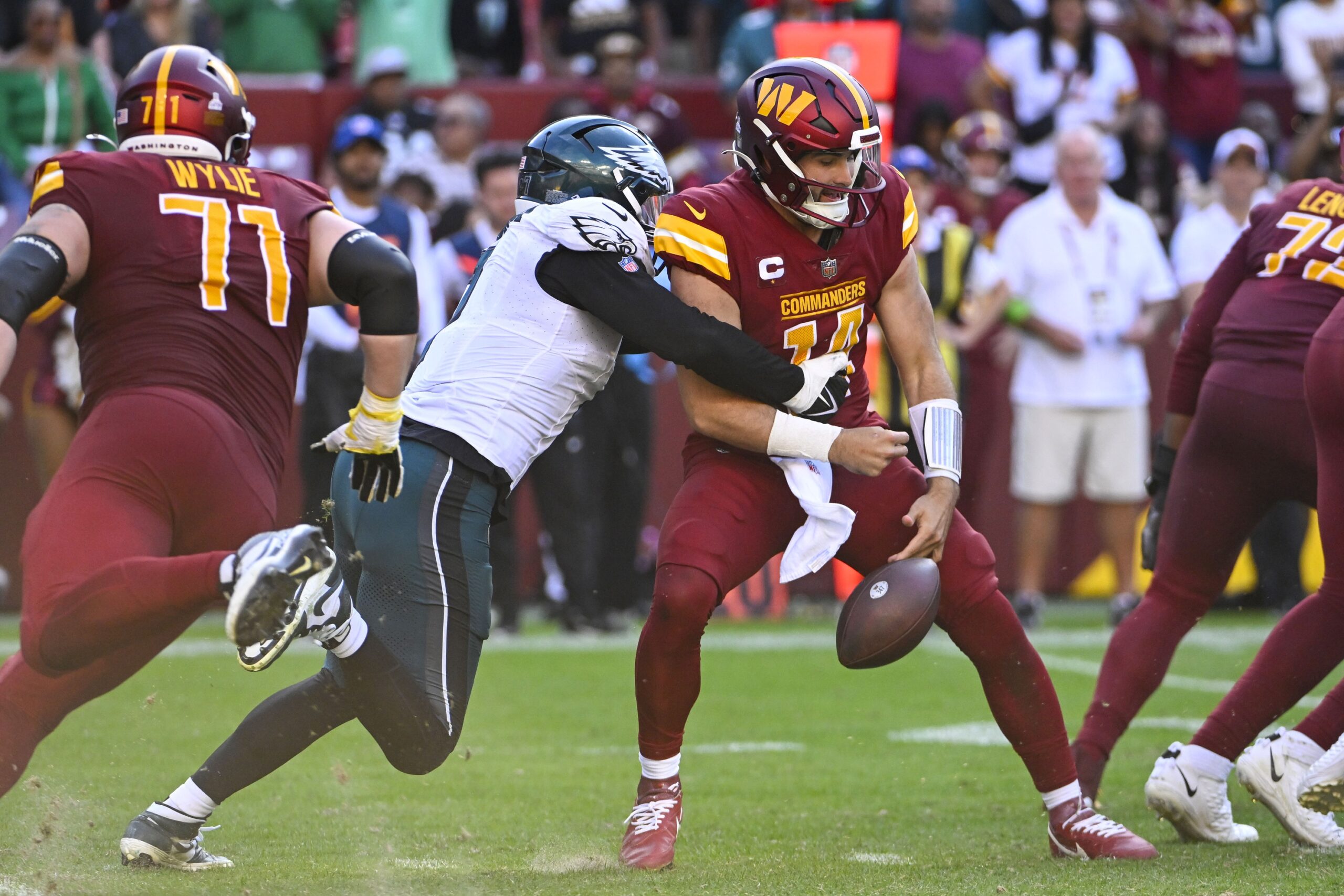 Oct 29, 2023; Landover, Maryland, USA; Philadelphia Eagles linebacker Haason Reddick (7) causes a fumble by Washington Commanders quarterback Sam Howell (14) during the second half at FedExField. Mandatory Credit: Brad Mills-Imagn Images (Jets)