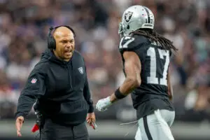 November 5, 2023; Paradise, Nevada, USA; Las Vegas Raiders interim head coach Antonio Pierce (left) high-fives wide receiver Davante Adams (17) after a touchdown against the New York Giants during the first quarter at Allegiant Stadium. Mandatory Credit: Kyle Terada-Imagn Images