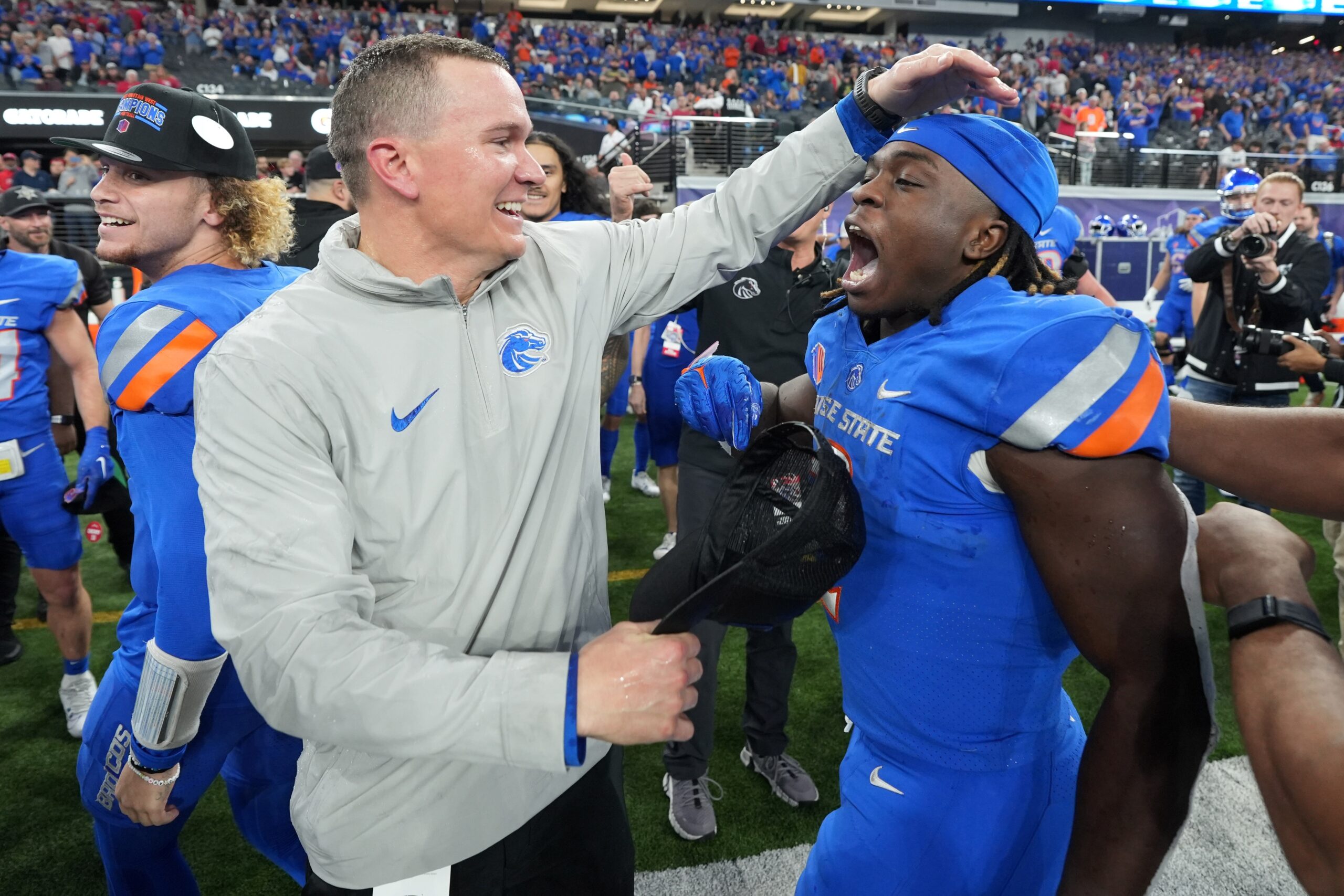 Dec 2, 2023; Las Vegas, NV, USA; Boise State Broncos head coach Spencer Danielson celebrates with running back Ashton Jeanty (2) after 44-20 victory over the UNLV Rebels in the Mountain West Championship at Allegiant Stadium. Mandatory Credit: Kirby Lee-Imagn Images (Bears)