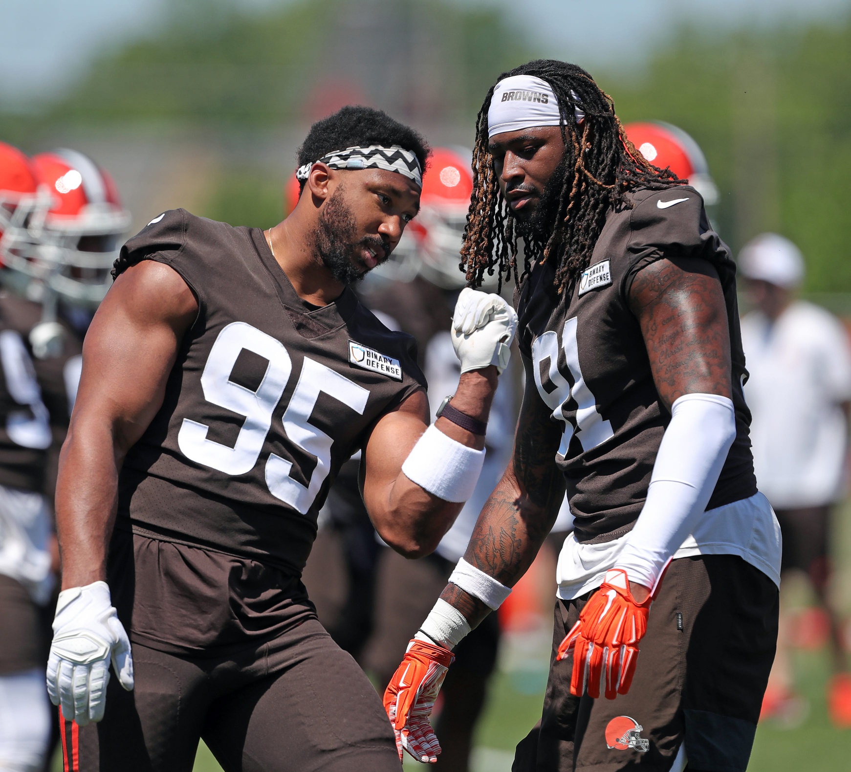 Browns defensive end Myles Garrett, left, works with defensive end Alex Wright during minicamp, Wednesday, June 12, 2024, in Berea. © Jeff Lange / USA TODAY NETWORK