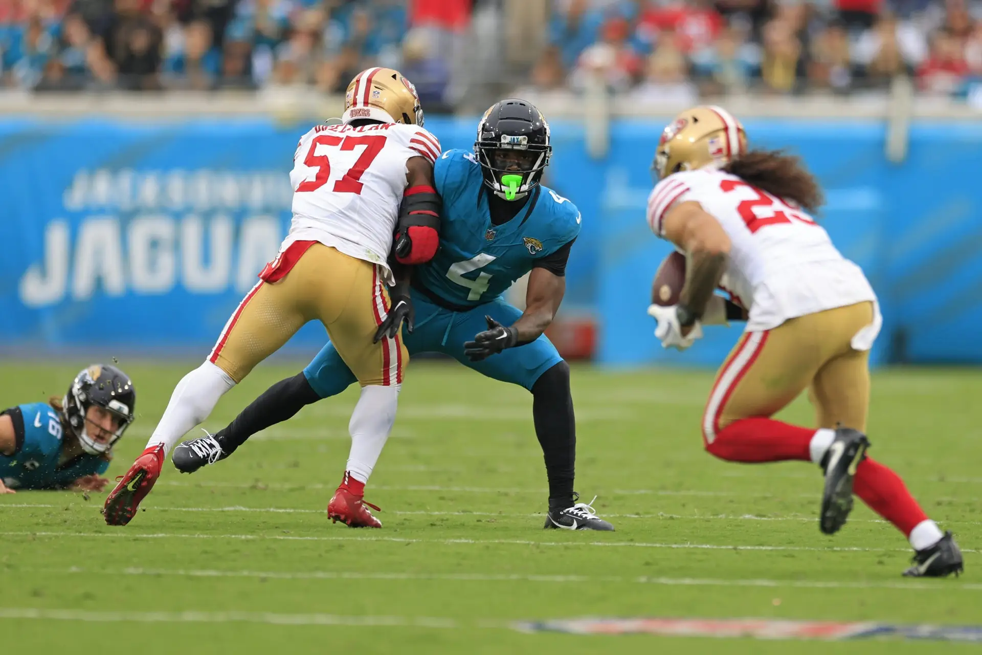 Jacksonville Jaguars running back Tank Bigsby (4) watches a pass interned for him get tipped into the hands of San Francisco 49ers safety Talanoa Hufanga (29) as linebacker Dre Greenlaw (57) defends during the third quarter of an NFL football game Sunday, Nov. 12, 2023 at EverBank Stadium in Jacksonville, Fla. The San Francisco 49ers defeated the Jacksonville Jaguars 34-3. [Corey Perrine/Florida Times-Union]