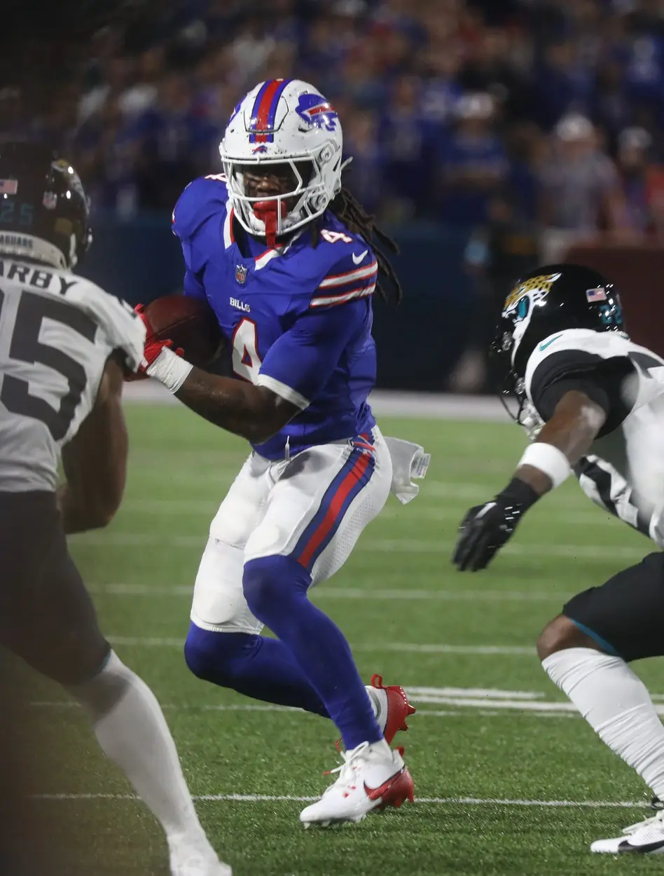 Bills James Cook finds an open lane and tries to get through it during first half action at Highmark Stadium in Orchard Park on Sept. 23, 2024. © Tina MacIntyre-Yee/Democrat and Chronicle / USA TODAY NETWORK via Imagn Images