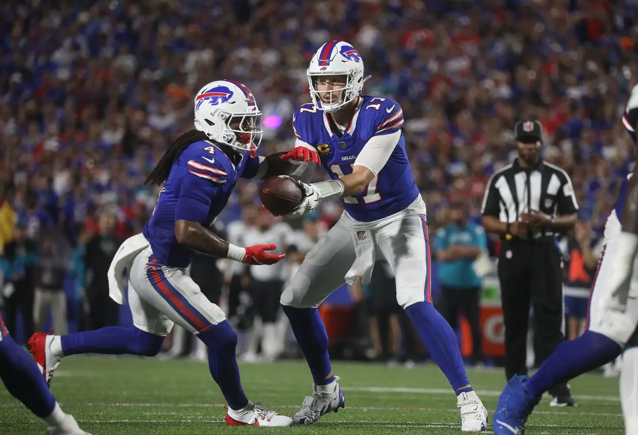 Bills quarterback Josh Allen hands off the ball to running back James Cook during first half action at Highmark Stadium in Orchard Park on Sept. 23, 2024. © Tina MacIntyre-Yee/Democrat and Chronicle / USA TODAY NETWORK via Imagn Images