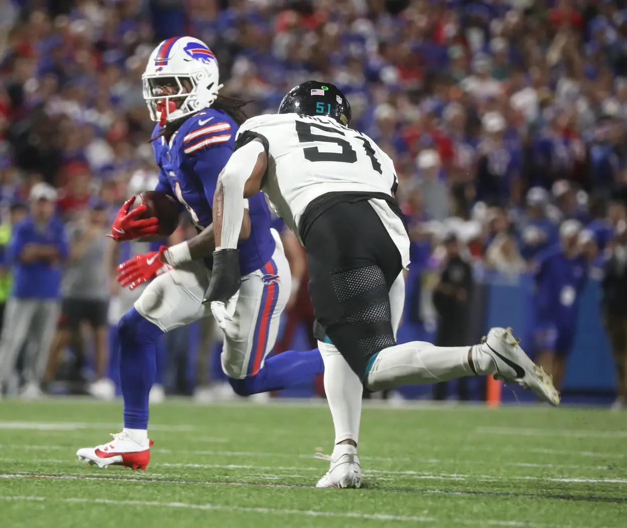 Bills James Cook gets a clear path to run before Jaguars Ventrell Miller catches him during the second half at Highmark Stadium in Orchard Park on Sept. 23, 2024. © Tina MacIntyre-Yee/Democrat and Chronicle / USA TODAY NETWORK via Imagn Images