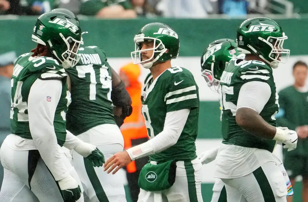 Sep 29, 2024; East Rutherford, New Jersey, USA; New York Jets quarterback Aaron Rodgers (8) reacts after the Jets failed to score on the Denver Broncos late in the fourth quarter at MetLife Stadium. Mandatory Credit: Robert Deutsch-Imagn Images