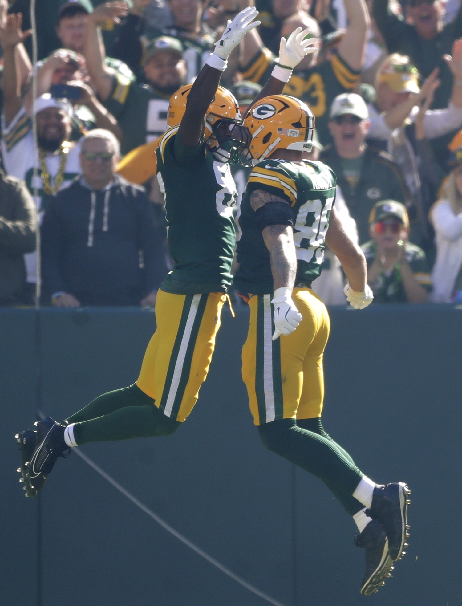 Sep 29, 2024; Green Bay, Wisconsin, USA; Green Bay Packers tight end Tucker Kraft (85) and wide receiver Romeo Doubs (87) celebrate following a 2 point conversion against the Minnesota Vikings during their football game on Sunday, September 29, 2024 at Lambeau Field in Green Bay, Wis. The Vikings defeated the Packers 31-29. Mandatory Credit: William Glasheen/USA TODAY Network via Imagn Images