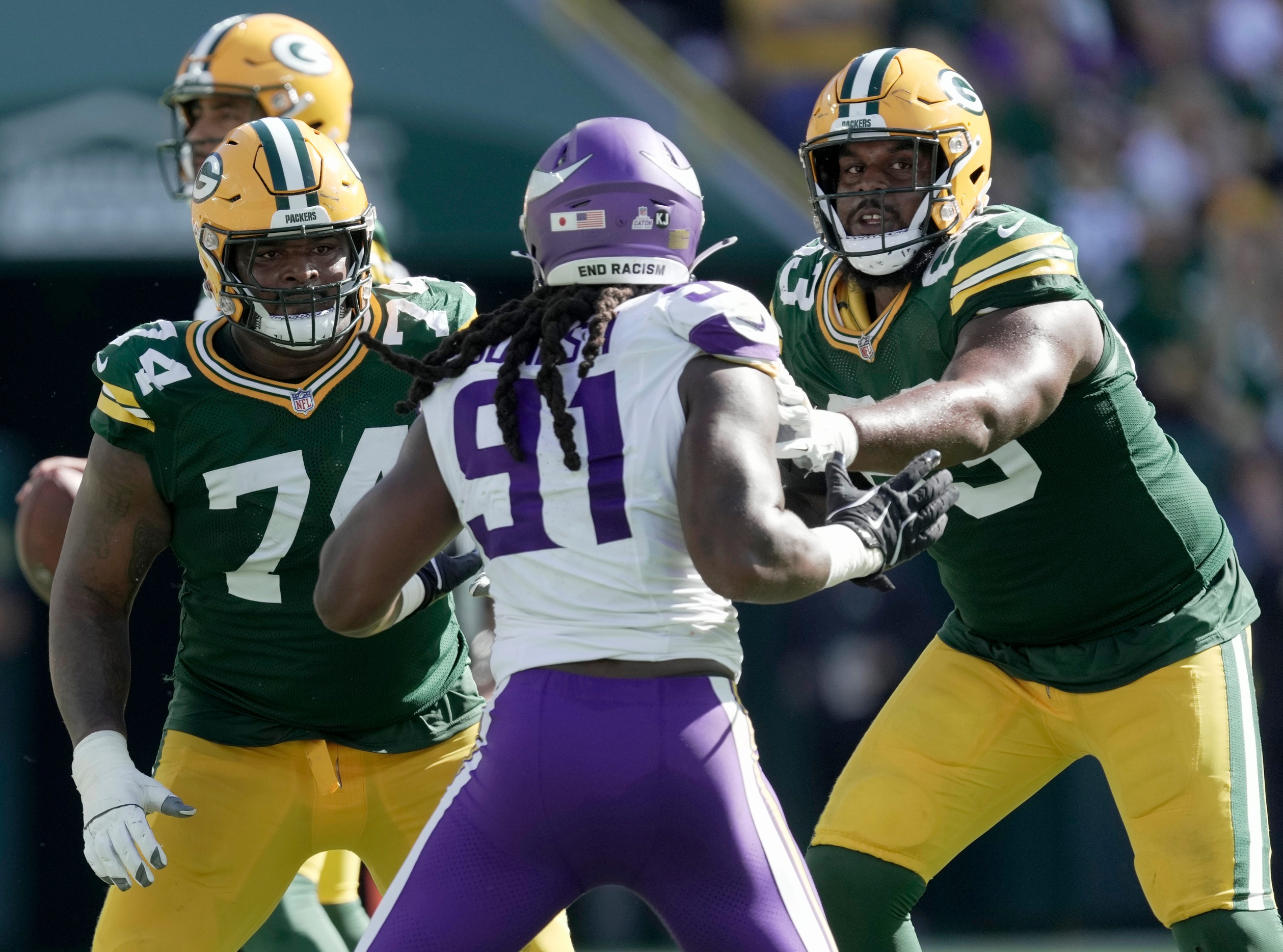 Green Bay Packers guard Elgton Jenkins (74) and offensive tackle Rasheed Walker (63) block Minnesota Vikings linebacker Pat Jones II (91) during the third quarter of their game Sunday, September 29, 2024 at Lambeau Field in Green Bay, Wisconsin. The Minnesota Vikings beat the Green Bay Packers 31-29. © Mark Hoffman/Milwaukee Journal Sentinel / USA TODAY NETWORK via Imagn Images