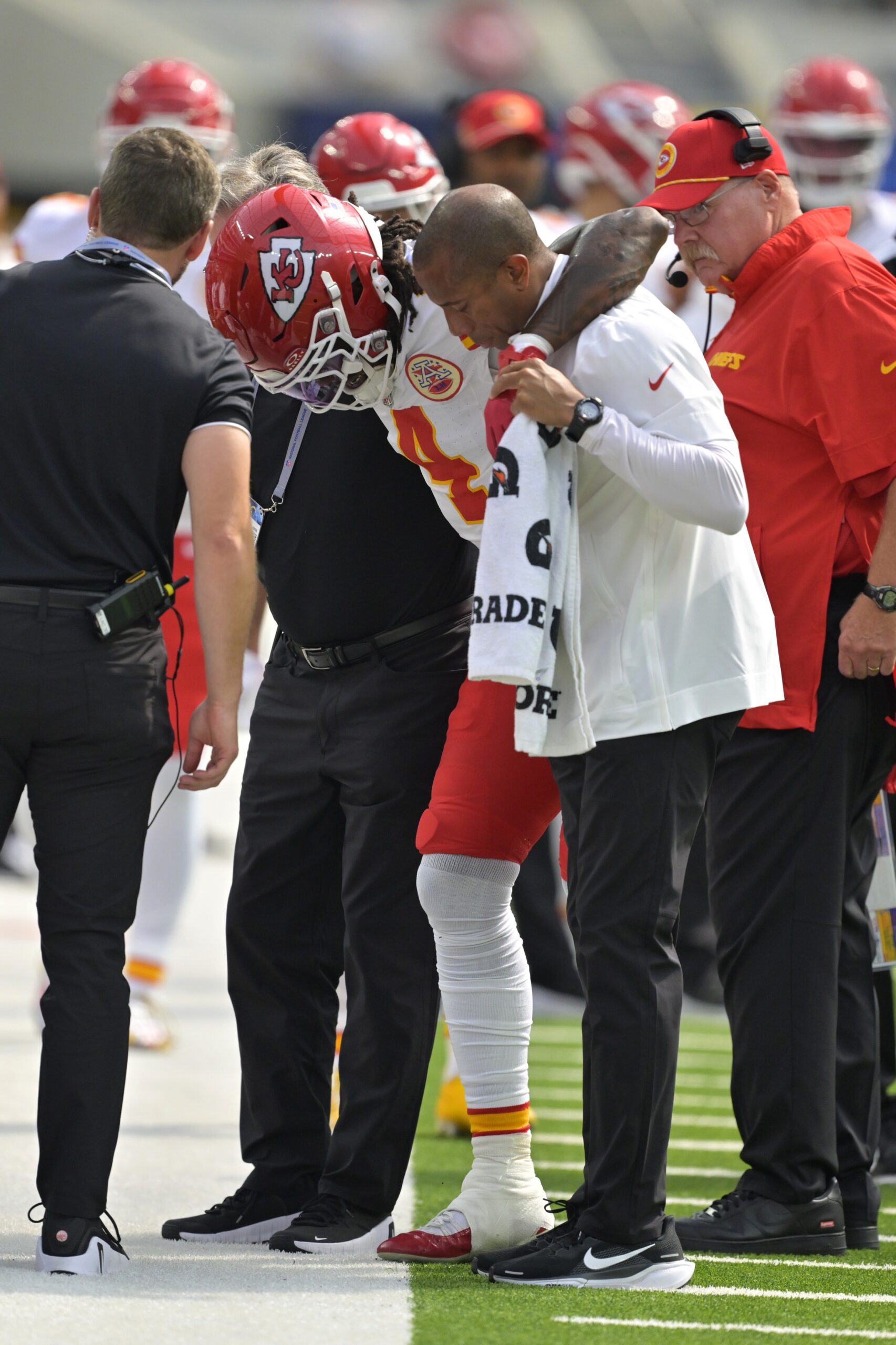 Sep 29, 2024; Inglewood, California, USA; Kansas City Chiefs wide receiver Rashee Rice (4) is assisted by medical staff after an injury in the first half against the Los Angeles Chargers at SoFi Stadium. Mandatory Credit: Jayne Kamin-Oncea-Imagn Images