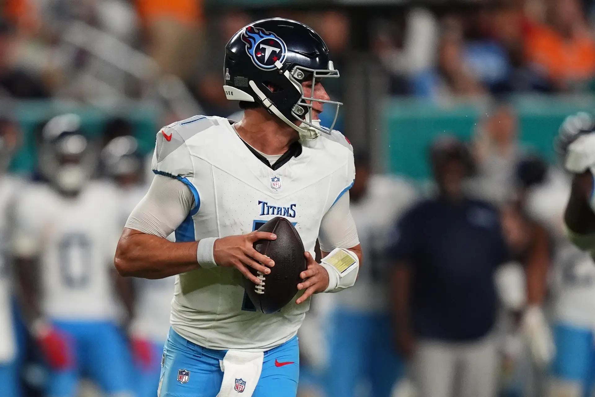 Sep 30, 2024; Miami Gardens, Florida, USA; Tennessee Titans quarterback Mason Rudolph (11) drops back with the ball during the second half against the Miami Dolphins at Hard Rock Stadium. Mandatory Credit: Jasen Vinlove-Imagn Images