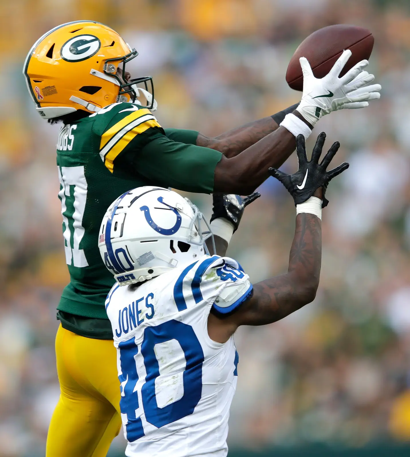 Green Bay Packers wide receiver Romeo Doubs (87) pulls down a long first down reception against Indianapolis Colts cornerback Jaylon Jones (40) in the fourth quarter during their football game Sunday, September 15, 2024, at Lambeau Field in Green Bay, Wisconsin. © Dan Powers/USA TODAY NETWORK-Wisconsin / USA TODAY NETWORK via Imagn Images