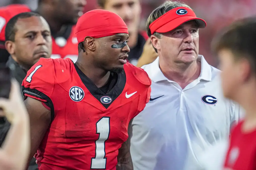 Oct 5, 2024; Athens, Georgia, USA; Georgia Bulldogs running back Trevor Etienne (1) walks off the field with head coach Kirby Smart after Georgia defeated the Auburn Tigers at Sanford Stadium. Mandatory Credit: Dale Zanine-Imagn Images