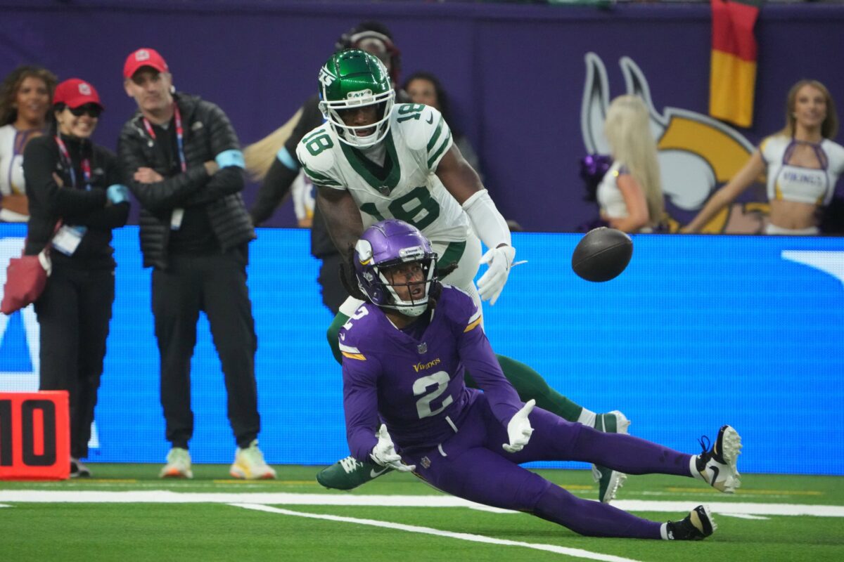 Oct 6, 2024; London, United Kingdom; Minnesota Vikings cornerback Stephon Gilmore (2) intercepts a pass intended for New York Jets wide receiver Mike Williams (18) in the fourth quarter at Tottenham Hotspur Stadium. Mandatory Credit: Kirby Lee-Imagn Images