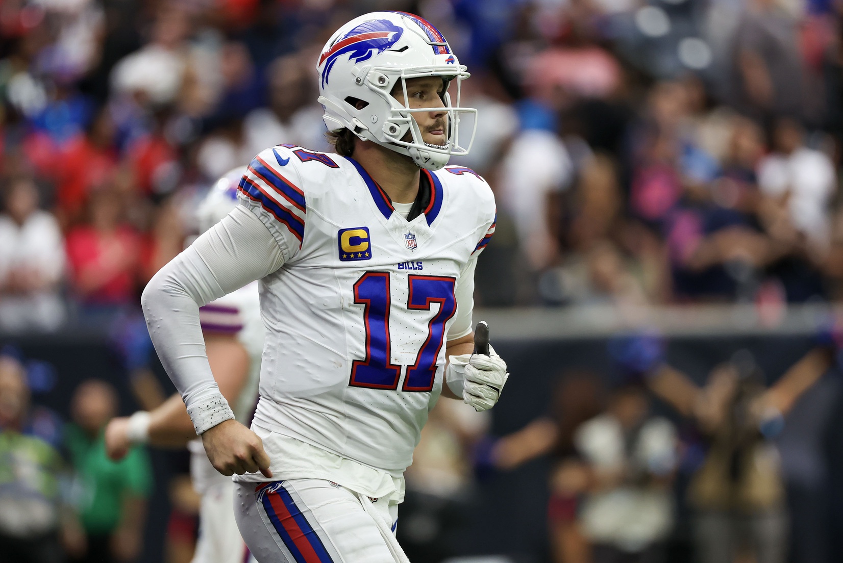 Oct 6, 2024; Houston, Texas, USA; Buffalo Bills quarterback Josh Allen (17) runs off the field before the Bills punt to the Houston Texans in the fourth quarter at NRG Stadium. Mandatory Credit: Thomas Shea-Imagn Images