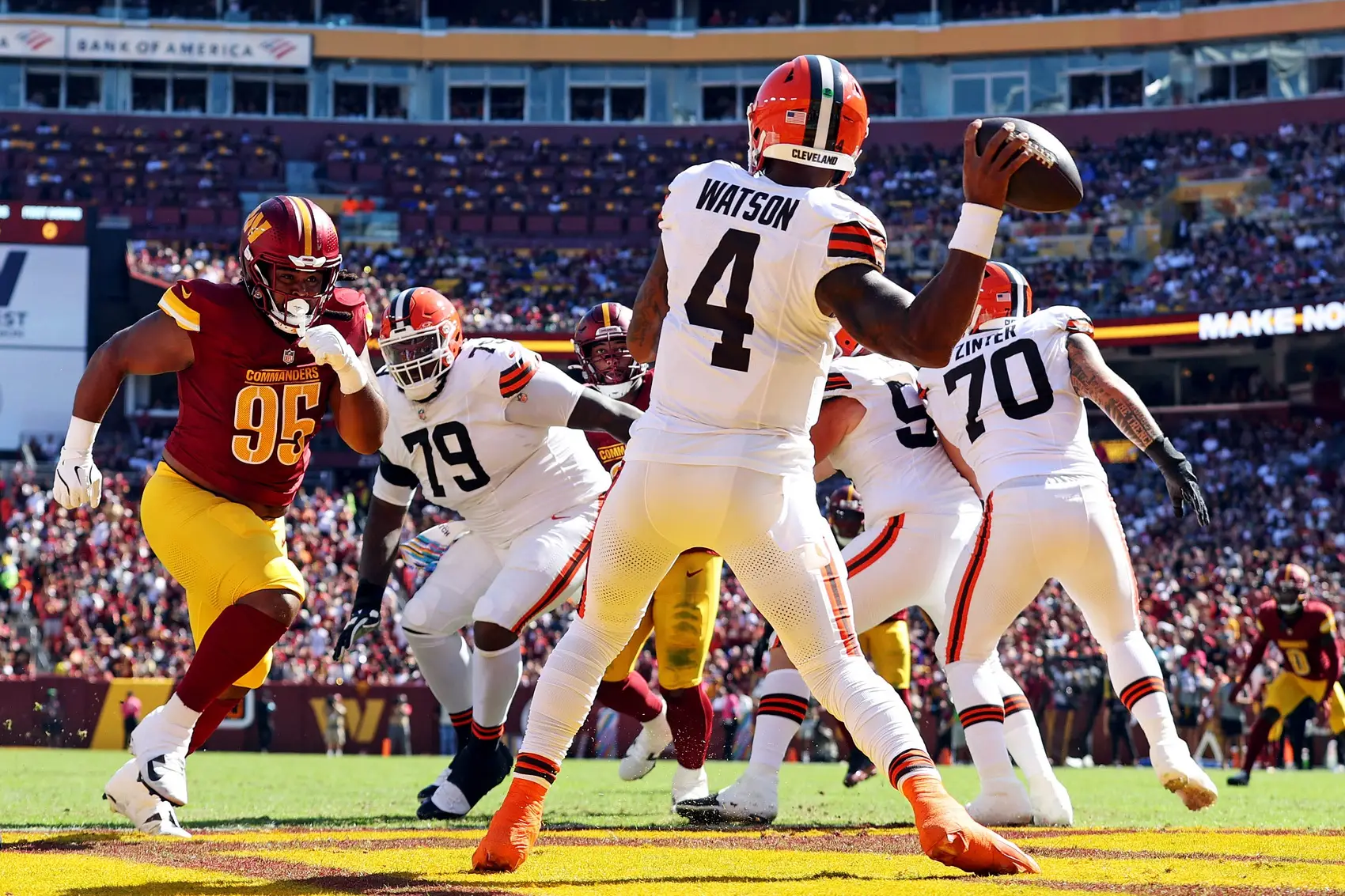 Oct 6, 2024; Landover, Maryland, USA; Cleveland Browns quarterback Deshaun Watson (4) throws a pass against Washington Commanders defensive tackle Jer'Zhan Newton (95) during the second quarter at NorthWest Stadium. Mandatory Credit: Peter Casey-Imagn Images