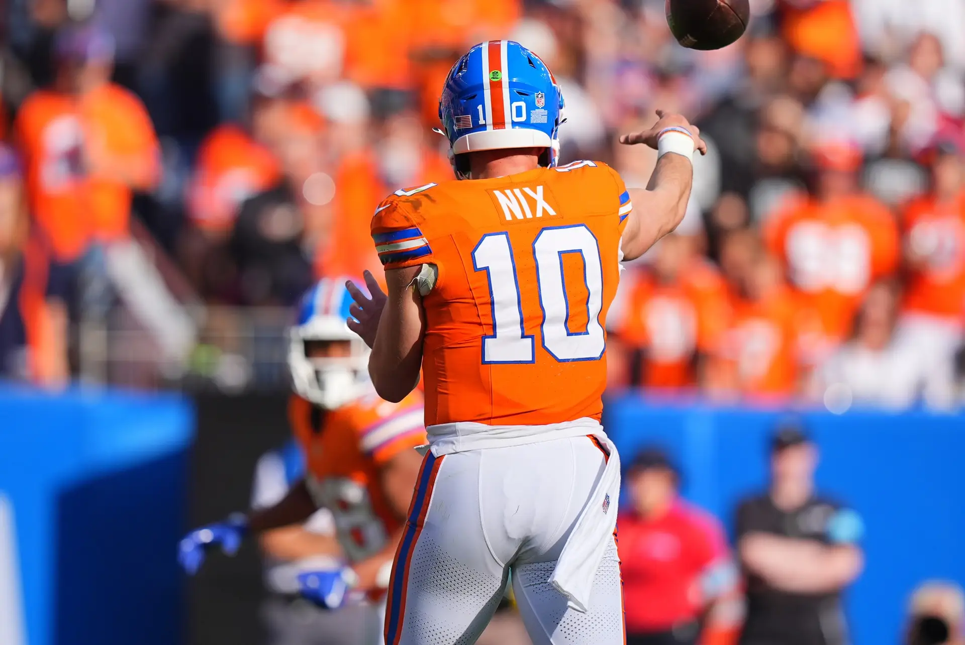 Oct 6, 2024; Denver, Colorado, USA; Denver Broncos quarterback Bo Nix (10) passes to running back Jaleel McLaughlin (38) for a touchdown in the third quarter against the Las Vegas Raiders at Empower Field at Mile High. Mandatory Credit: Ron Chenoy-Imagn Images