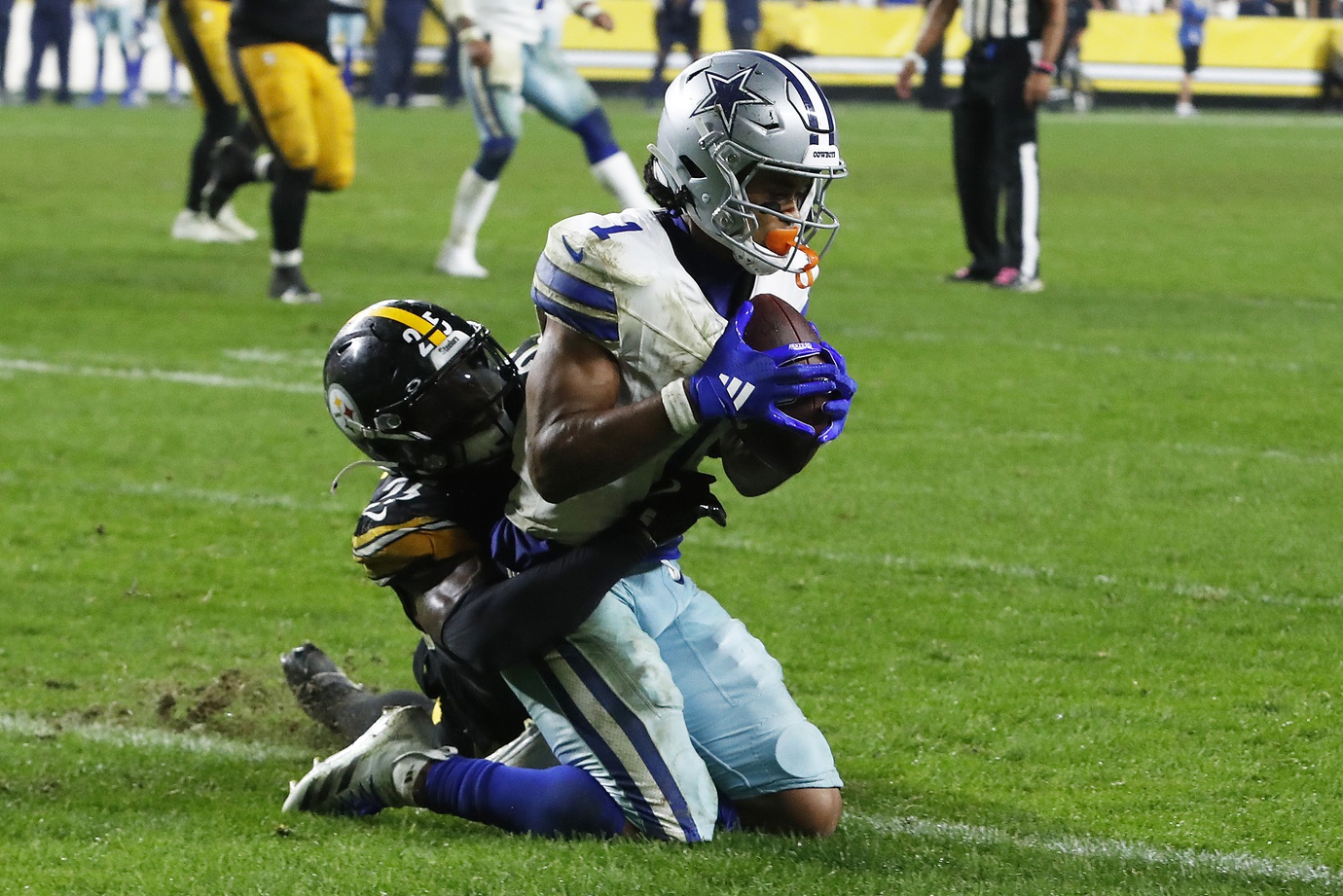 Oct 6, 2024; Pittsburgh, Pennsylvania, USA; Dallas Cowboys wide receiver Jalen Tolbert (1) scores the game winning touchdown against Pittsburgh Steelers safety DeShon Elliott (25) during the fourth quarter at Acrisure Stadium. Dallas won 20-17. Mandatory Credit: Charles LeClaire-Imagn Images