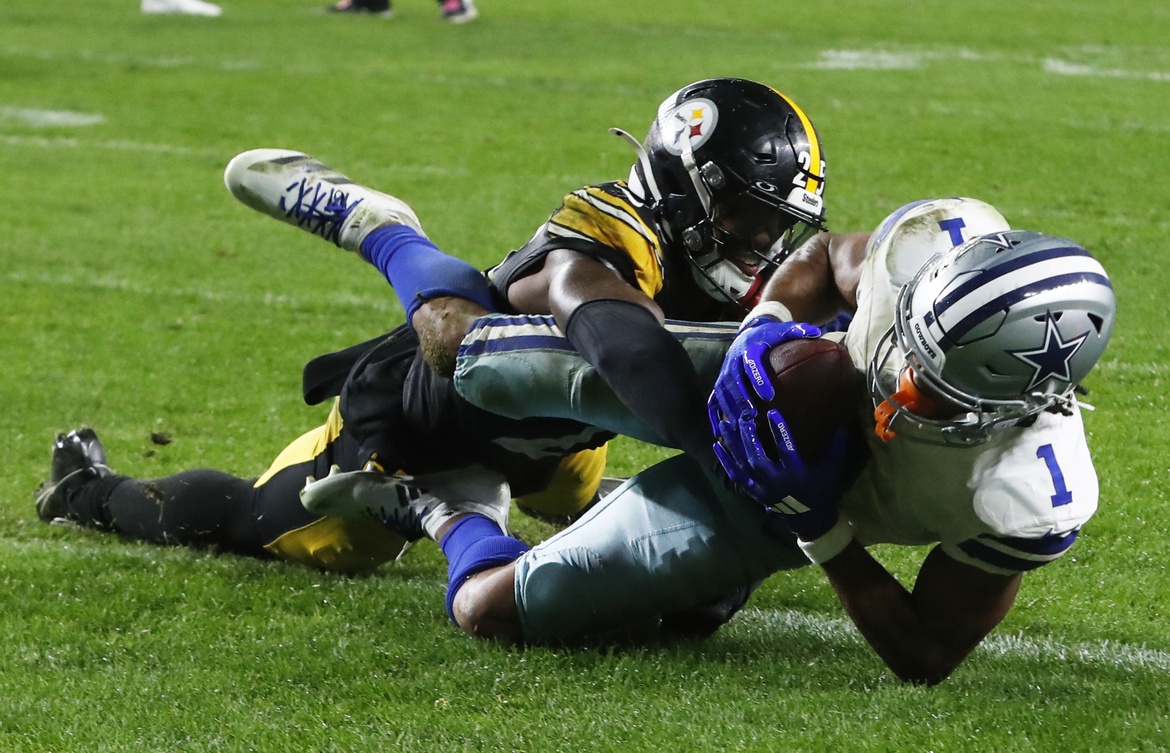 Oct 6, 2024; Pittsburgh, Pennsylvania, USA; Dallas Cowboys wide receiver Jalen Tolbert (1) scores the game winning touchdown against Pittsburgh Steelers safety DeShon Elliott (25) during the fourth quarter at Acrisure Stadium. Dallas won 20-17. Mandatory Credit: Charles LeClaire-Imagn Images