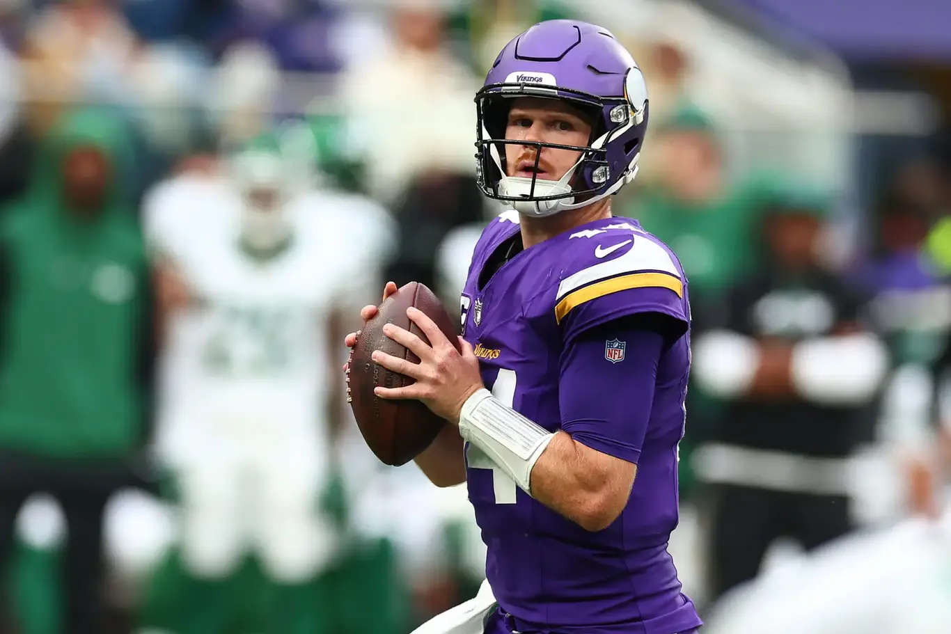 Oct 6, 2024; Tottenham, ENG; Minnesota Vikings Quarterback Sam Darnold (14) looks to throw a pass in the 1st Quarter against New York Jets at Tottenham Hotspur Stadium. Mandatory Credit: Shaun Brooks-Imagn Images