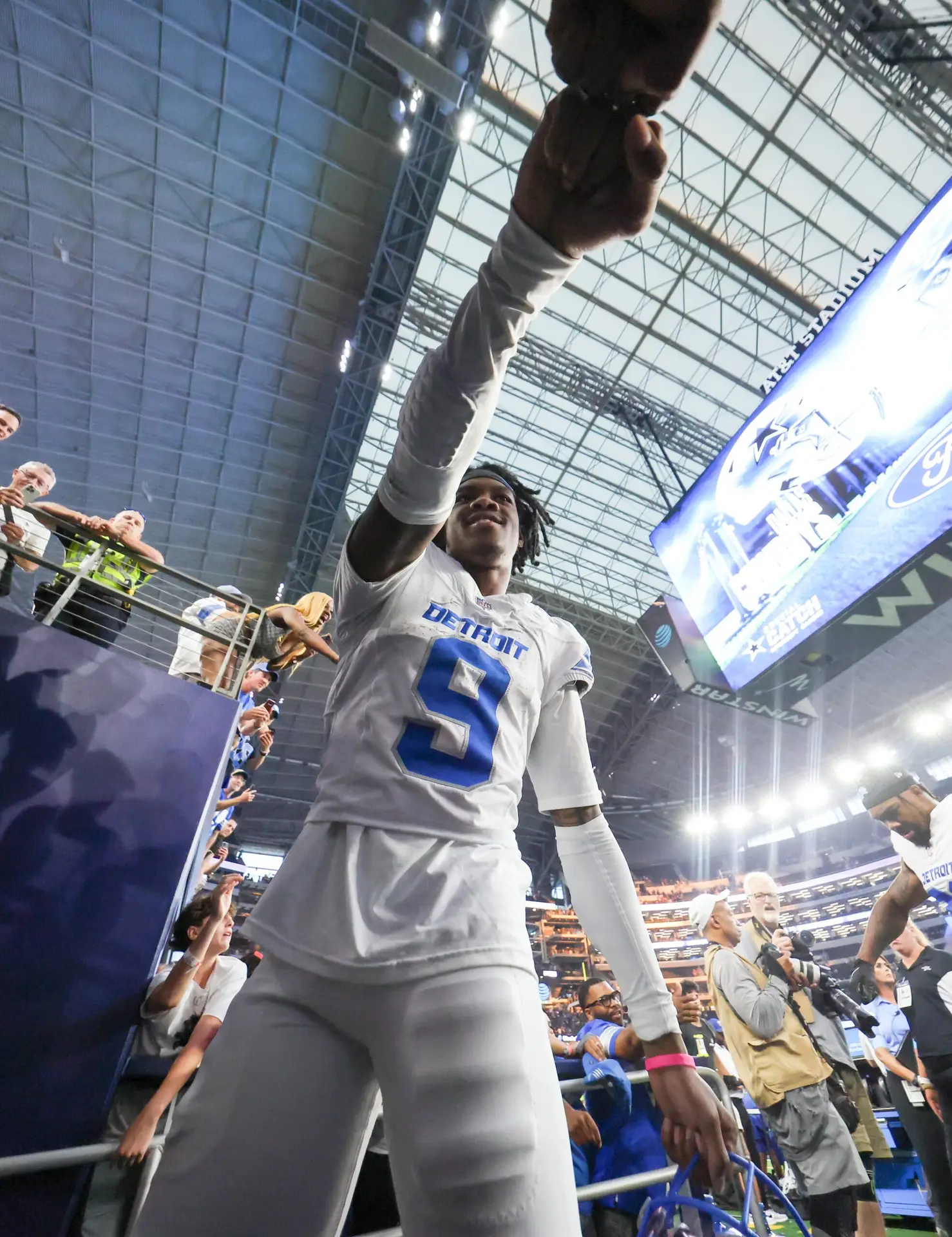 Oct 13, 2024; Arlington, Texas, USA; Detroit Lions wide receiver Jameson Williams (9) celebrates with fans after the game against the Dallas Cowboys at AT&T Stadium. Mandatory Credit: Kevin Jairaj-Imagn Images