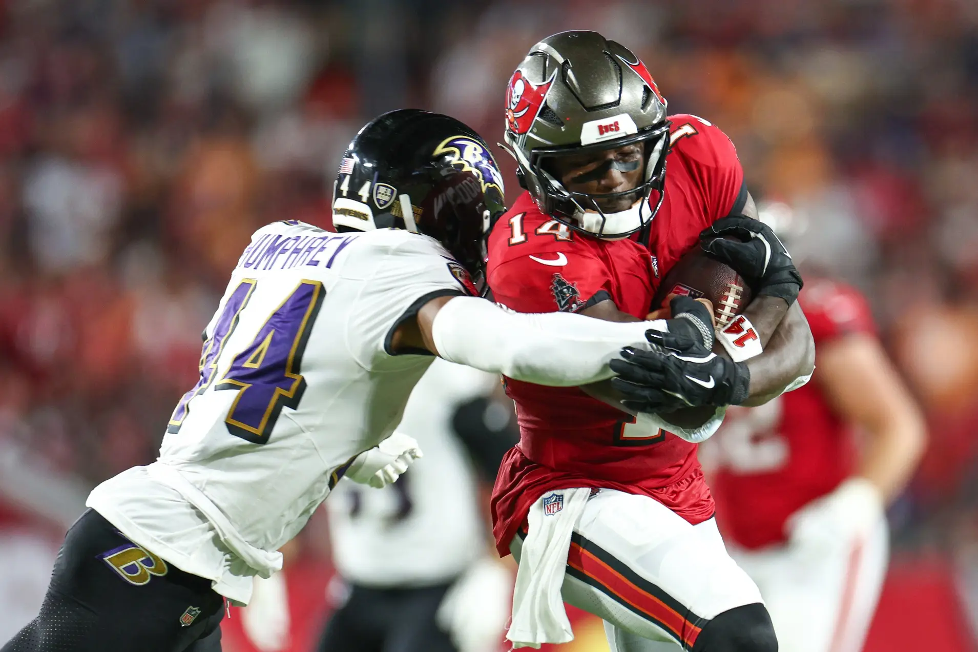 Oct 21, 2024; Tampa, Florida, USA; Tampa Bay Buccaneers wide receiver Chris Godwin (14) is pressured by Baltimore Ravens cornerback Marlon Humphrey (44) in the second quarter at Raymond James Stadium. Mandatory Credit: Nathan Ray Seebeck-Imagn Images