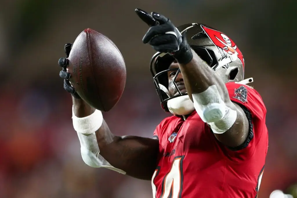 Oct 21, 2024; Tampa, Florida, USA; Tampa Bay Buccaneers wide receiver Chris Godwin (14) celebrates a first down against the Baltimore Ravens in the second quarter at Raymond James Stadium. Mandatory Credit: Nathan Ray Seebeck-Imagn Images