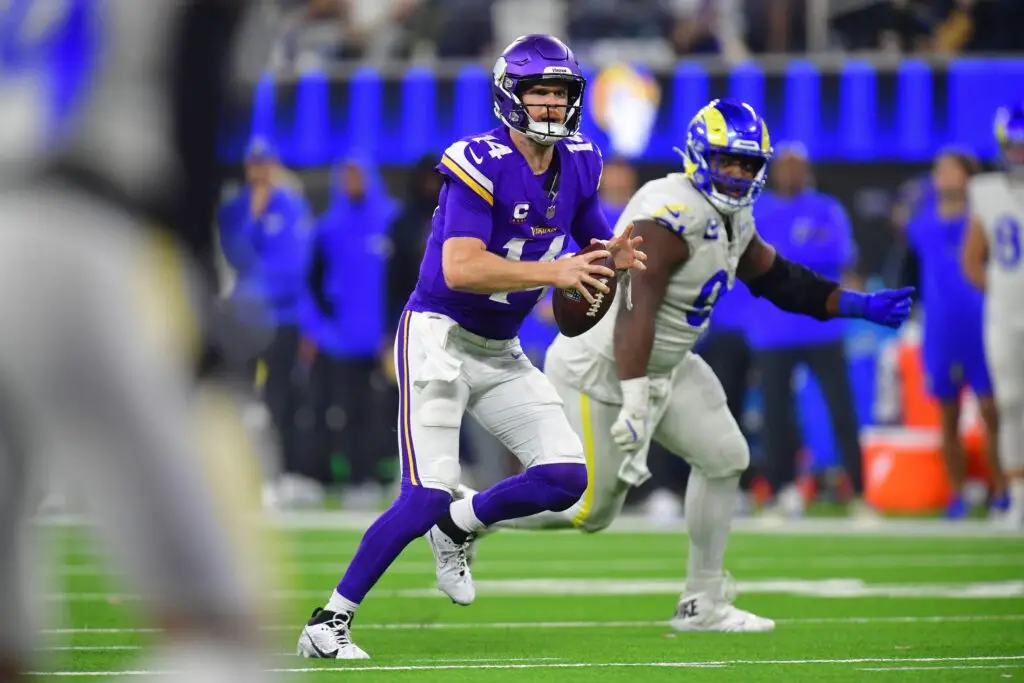 Oct 24, 2024; Inglewood, California, USA; Minnesota Vikings quarterback Sam Darnold (14) runs the ball against the Los Angeles Rams during the second half at SoFi Stadium. Mandatory Credit: Gary A. Vasquez-Imagn Images