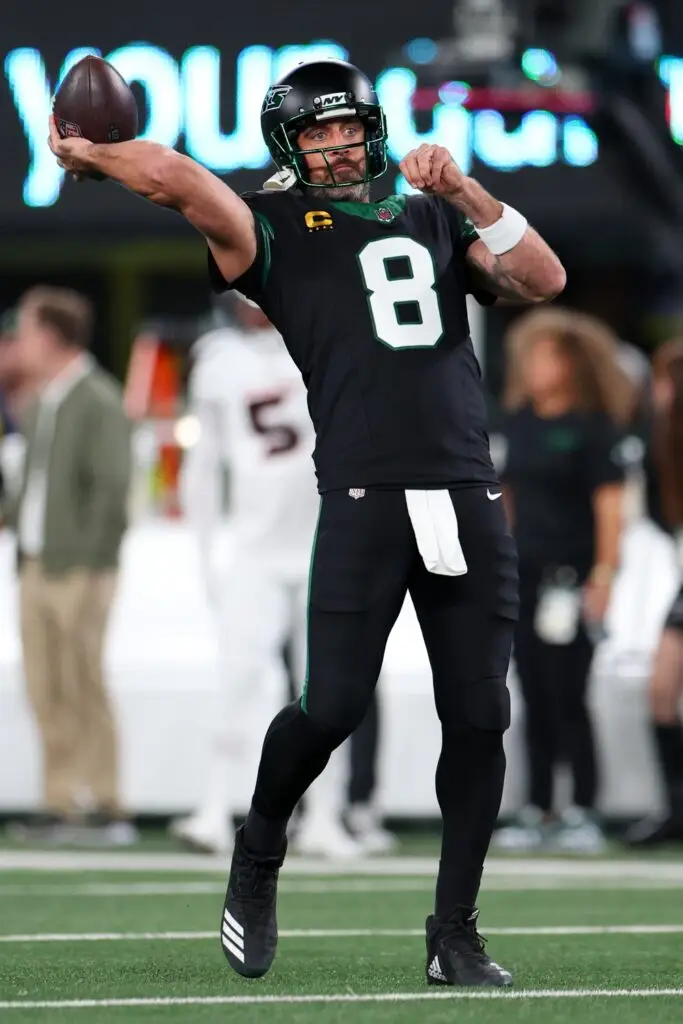 Oct 31, 2024; East Rutherford, New Jersey, USA; New York Jets quarterback Aaron Rodgers (8) throws a pass during pregame warmups for their game against the Houston Texans at MetLife Stadium. Mandatory Credit: Ed Mulholland-Imagn Images