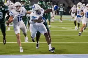 Nov 28, 2024; New Orleans, Louisiana, USA; Memphis Tigers running back Mario Anderson Jr. (2) scores a touchdown against the Tulane Green Wave during the fourth quarter at Yulman Stadium. Mandatory Credit: Matthew Hinton-Imagn Images Matthew Hinton, Matthew Hinton-Imagn Images