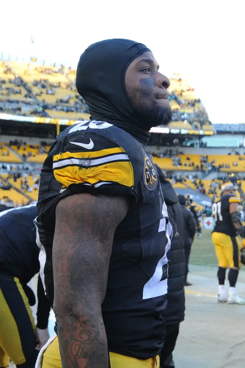 Jan 14, 2018; Pittsburgh, PA, USA; Pittsburgh Steelers running back Le'Veon Bell (26) looks on from the bench during the final seconds of the AFC Divisional Playoff game against the Jacksonville Jaguars at Heinz Field. The Jaguars won 45-42. Mandatory Credit: Philip G. Pavely-USA TODAY Sports